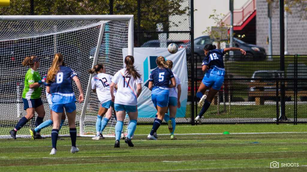 Harbourside player attacks a corner
