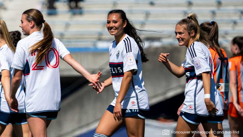 whitecaps player low five