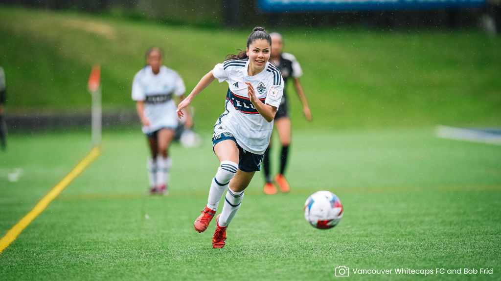 whitecaps player chasing ball